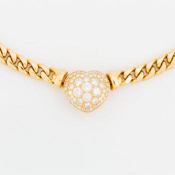 An 18K gold necklace set with round brilliant-cut diamonds.