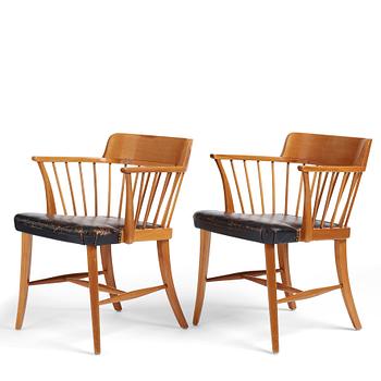 448. Josef Frank, a pair of mahogany and black leather 'Captain's chair', Svenskt Tenn, model 789B, acquired in 1950.