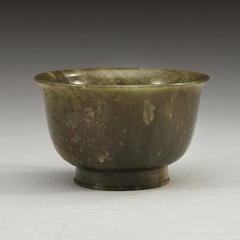 A green marble bowl, Qing dynasty (1644-1912), with Qianlong six character mark.