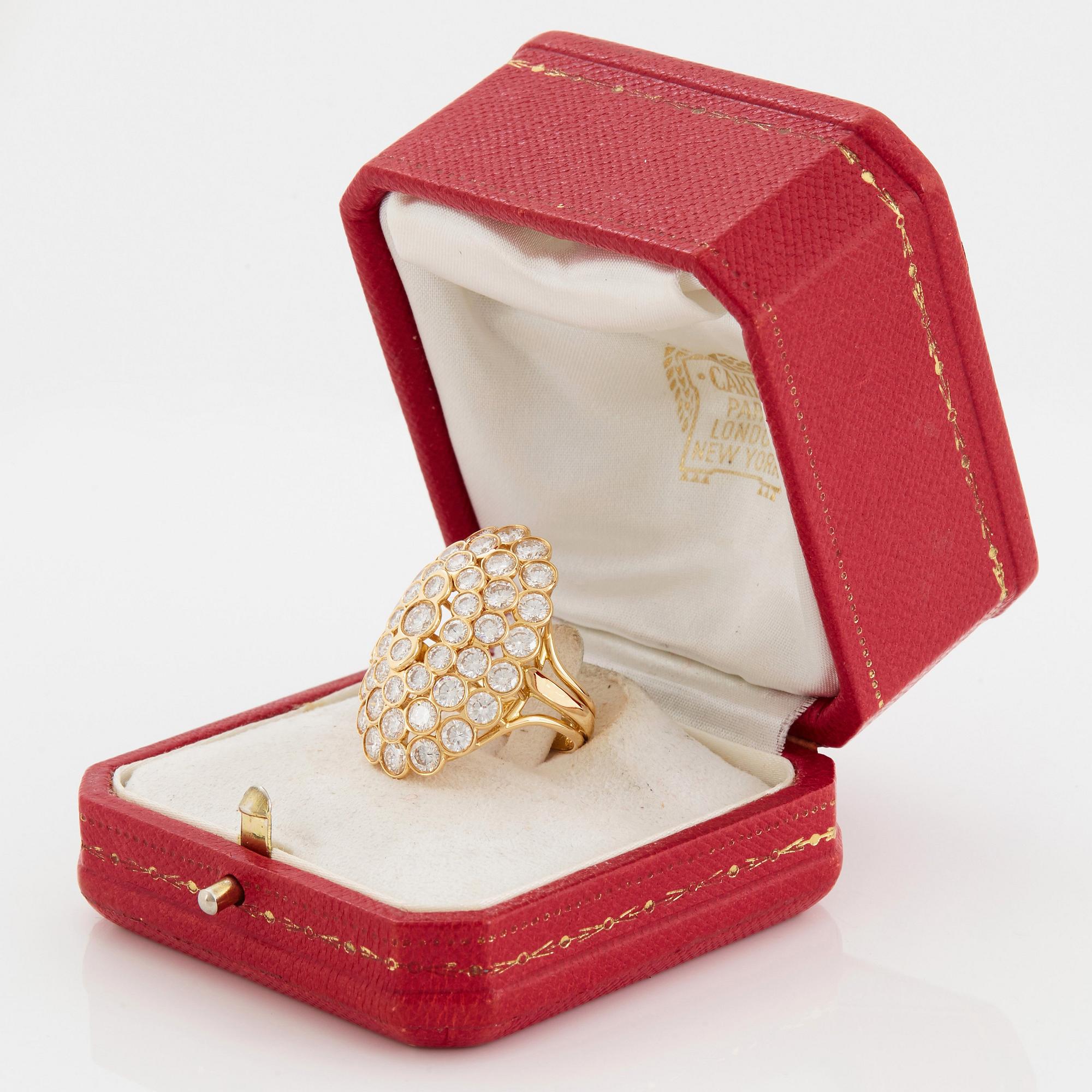 Cartier a ring in 18K gold set with round brilliant-cut diamonds.