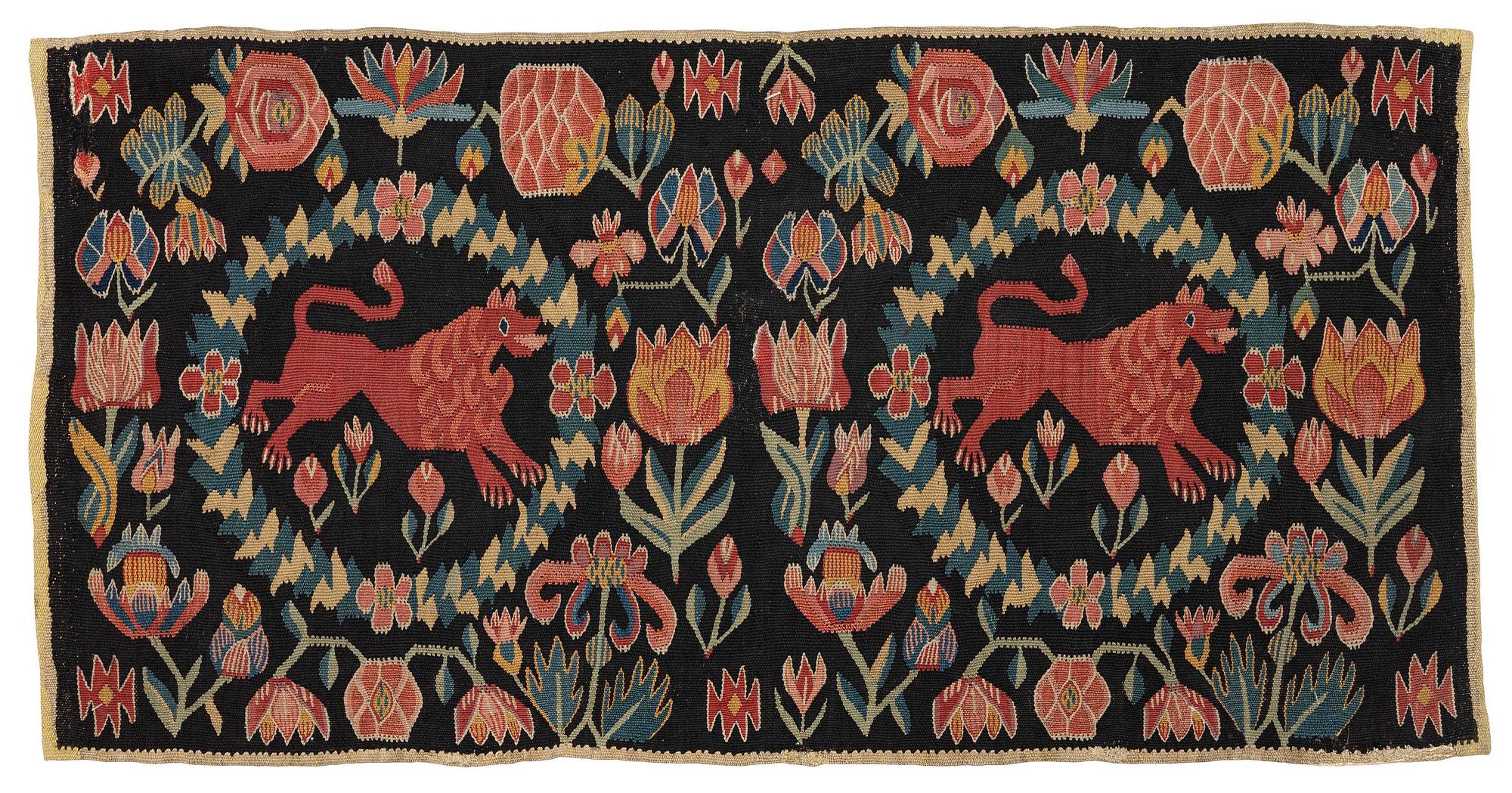 A cushion, 'Red Lion' (Rött Lejon), tapestry weave, c. 98 x 49 cm, Southwestern Scania, first part of the 19th century.