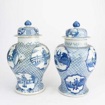 A pair of blue and white porcelain Kangxi style late Qing urns.