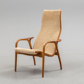 A Yngve Ekström teak and oak armchair.