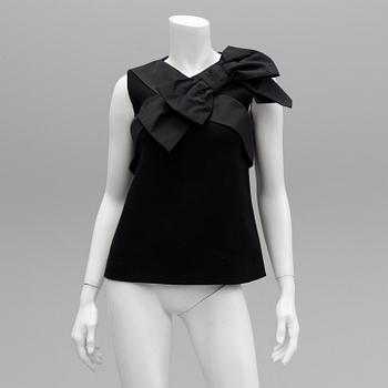 A black wool top by Moschino Boutique.