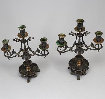 A pair of late 19th century bronze candelabra.