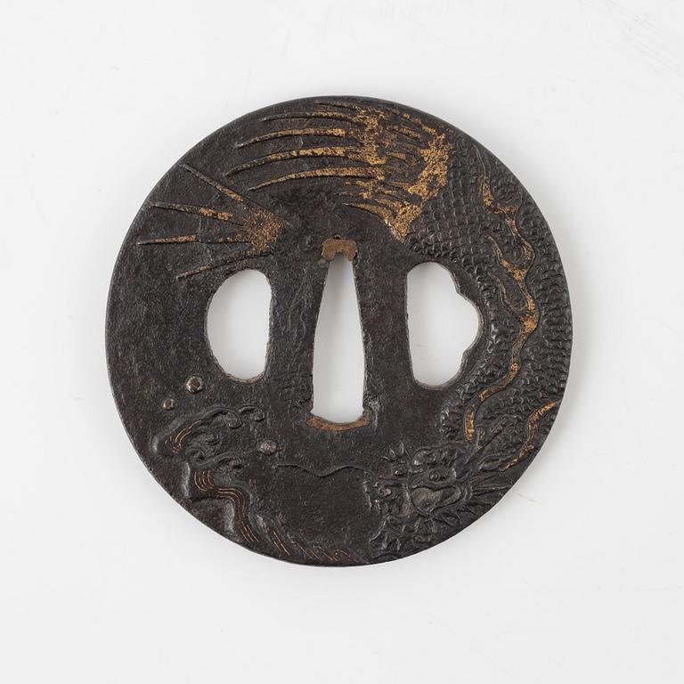 A round iron tsuba decorated with a dragon, Japan, Edo-period,