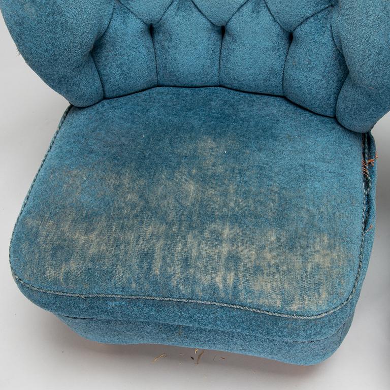 A pair of mid-20th-century armchairs.