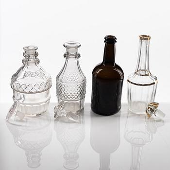 A set of eight glass bottles and decanters, circa 1800/19th Century.