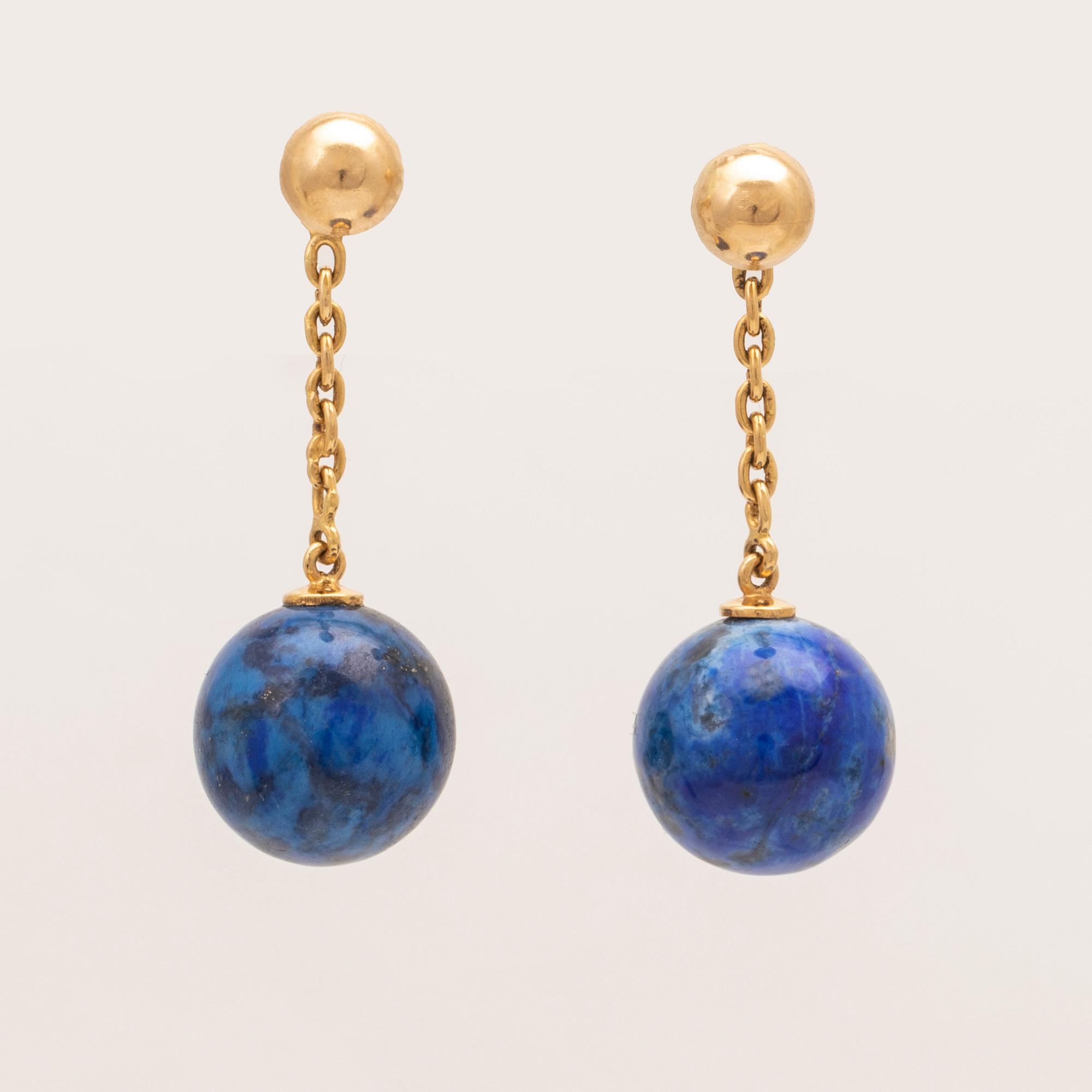 A set of lapis lazuli earrings and necklace.