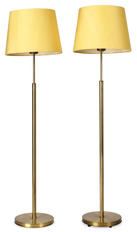 A pair of Josef Frank brass floor lamps, Firma Svenskt Tenn.