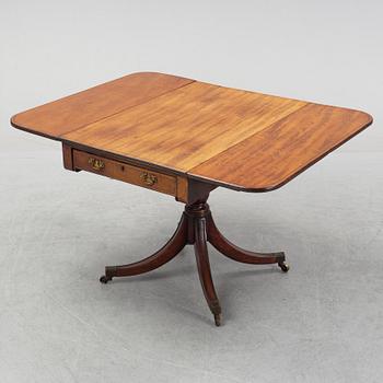 A mahognay drop leaf table, end of the 19th Century.