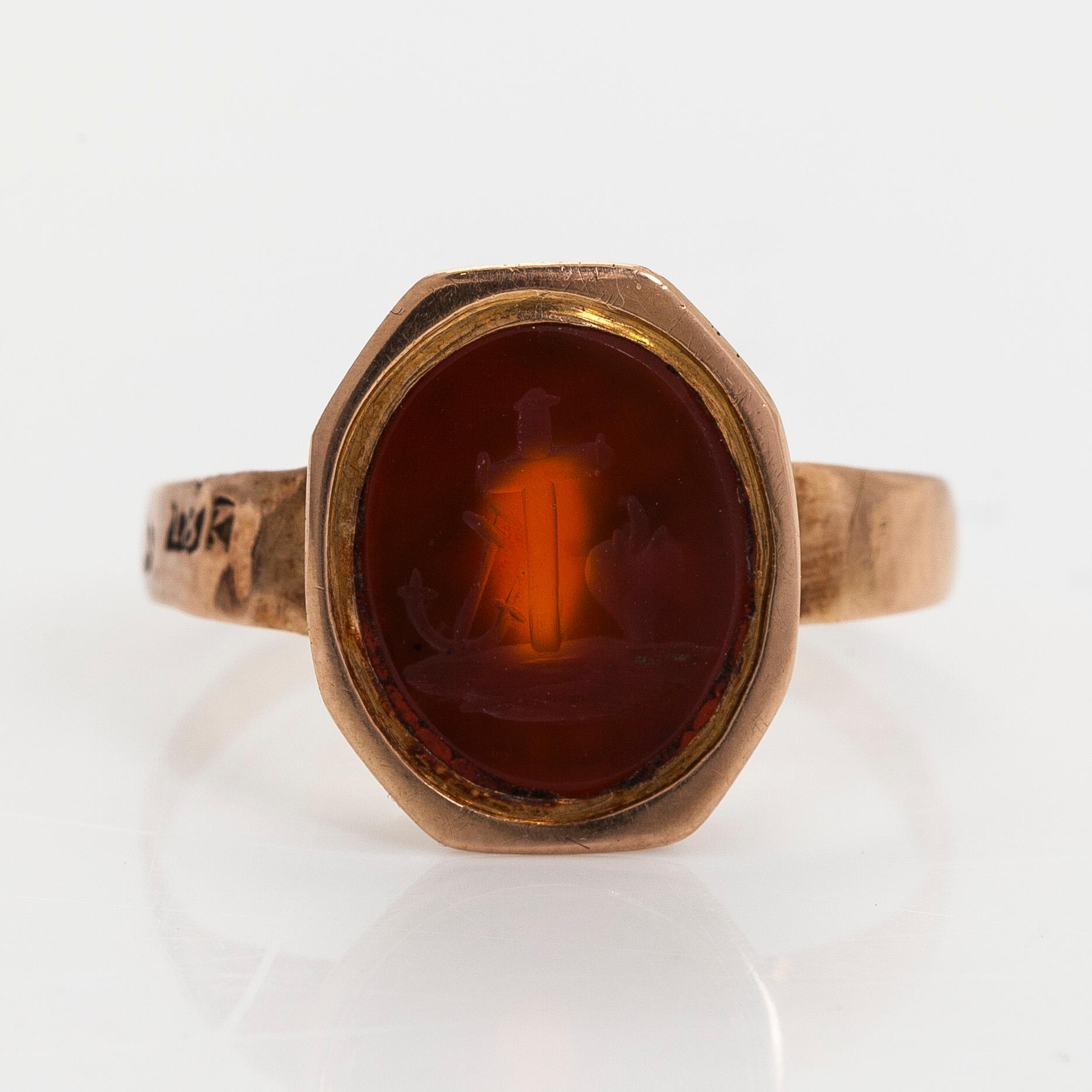 Ring, engraved carnelian "Faith, hope and love", 18K gold, Carl Johan Martin, Pori mid-19th century.