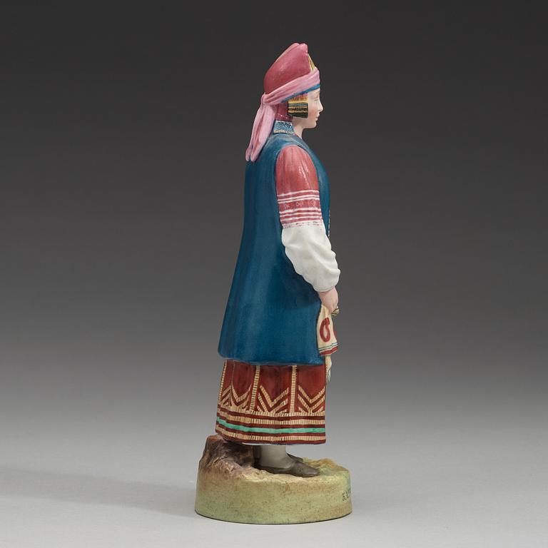 A Russian biscuit figure of a peasant woman from Kaluga, Gardner, Verbilki, Dmitrov gub, (1891-1917).