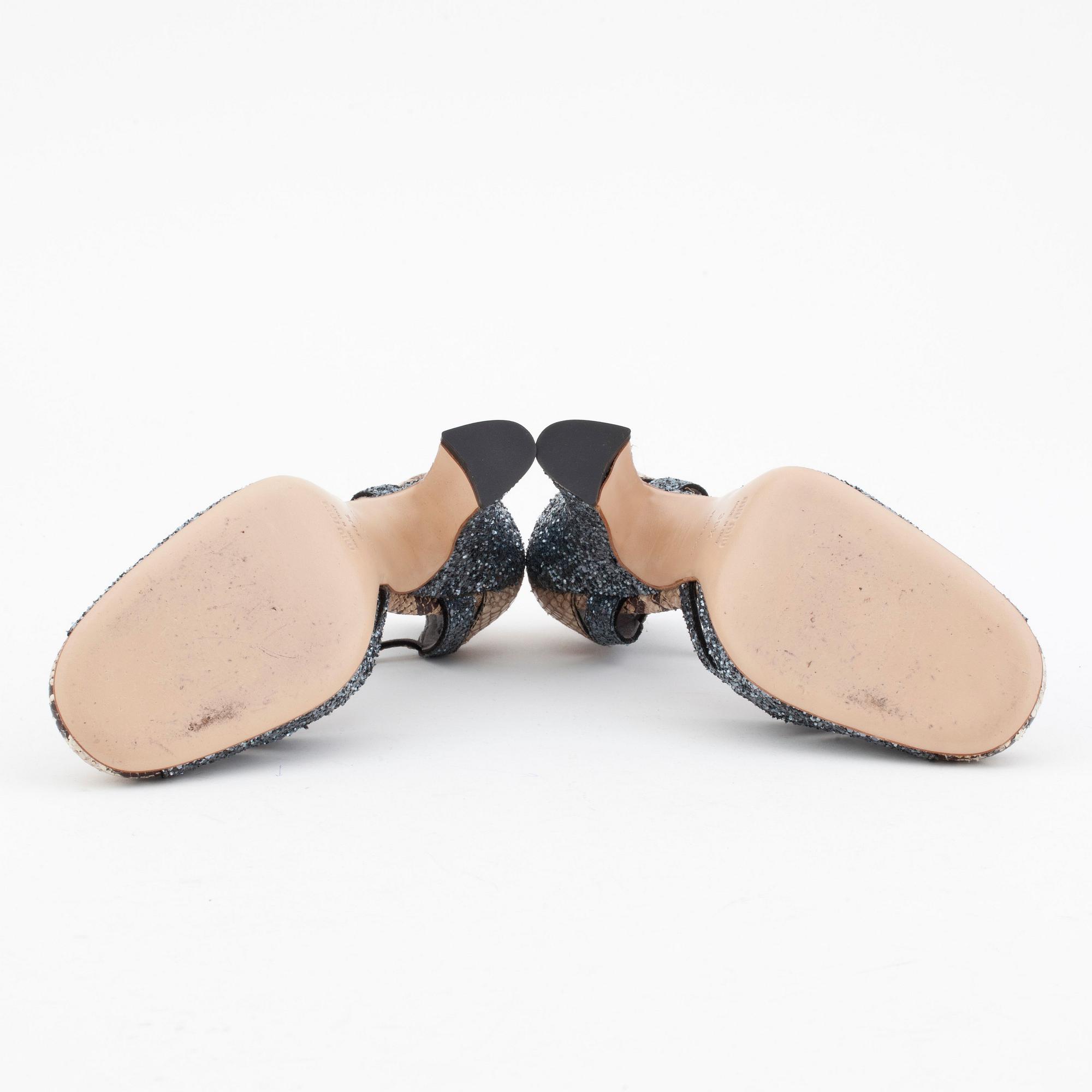 MIU MIU, a pair of snake skin embossed leather and glitter sandals.