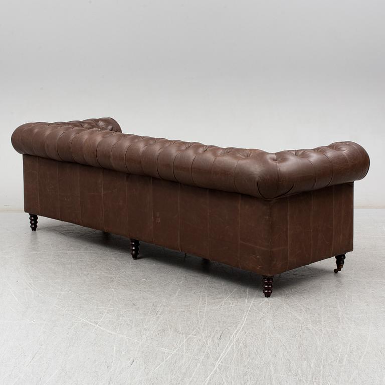 A modern chesterfield sofa.