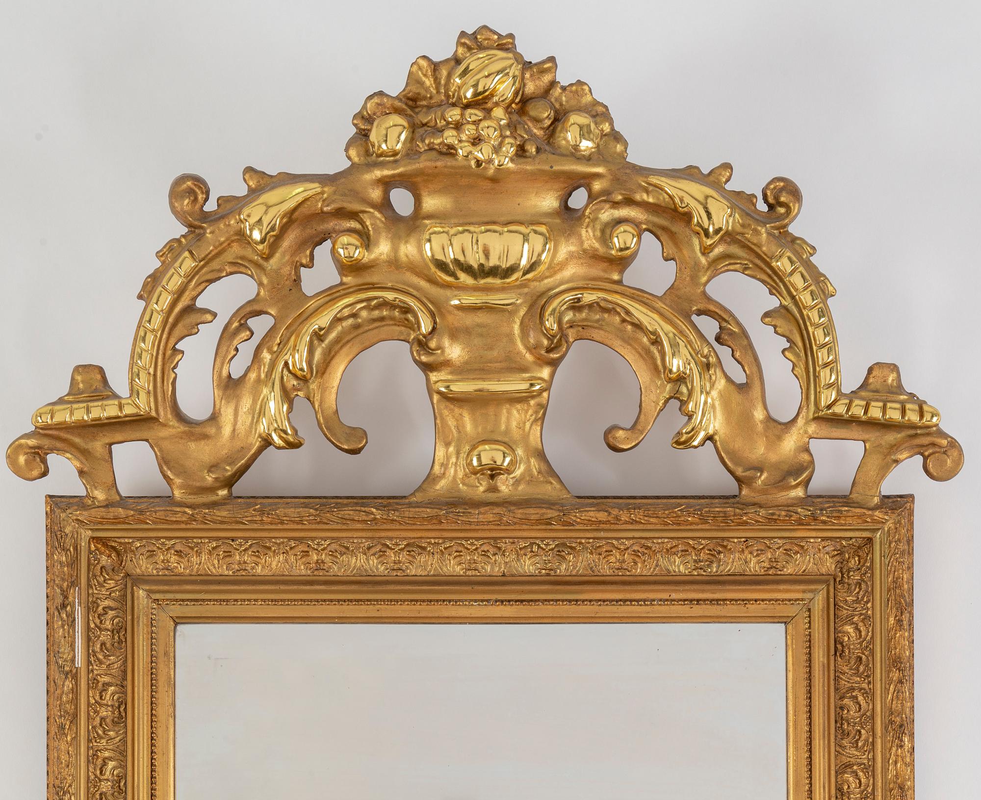 A second half of the 20th Century rococo style mirror with a console table.
