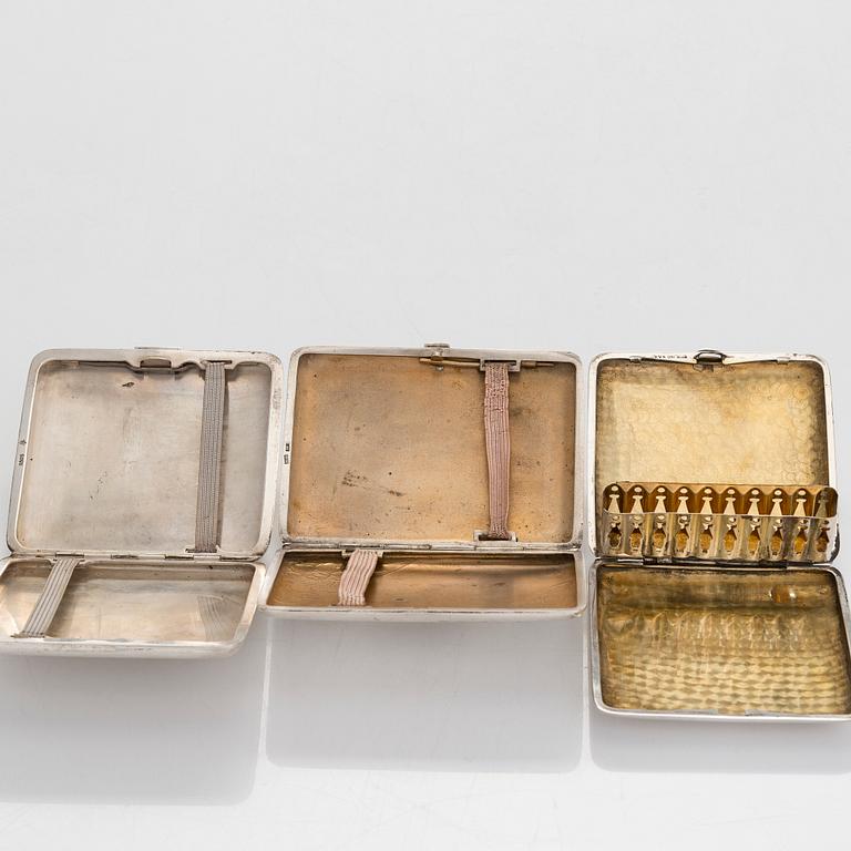 Three silver cigarette cases, incl. Nussbaum & Hunold and EL Weimann.