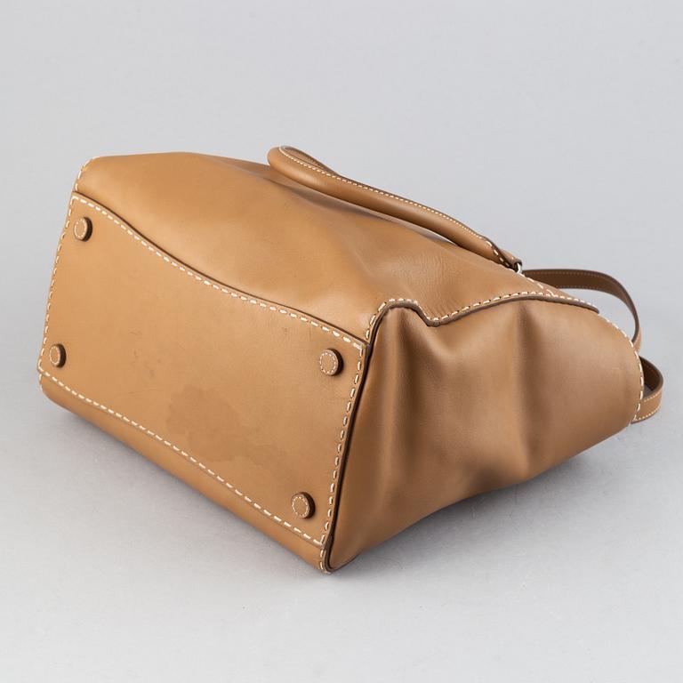 Prada, a leather handbag.
