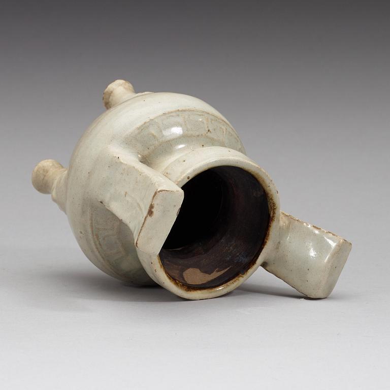 A pale grey-bluish glazed tripod censer with decor in relief, and archaistic mark, Ming dynasty (1368-1644).