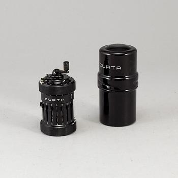 A 'Curta, Type I' calculator developed by Curt Herzstark, Contina AG Mauren, Lichtenstein, designed in 1947.