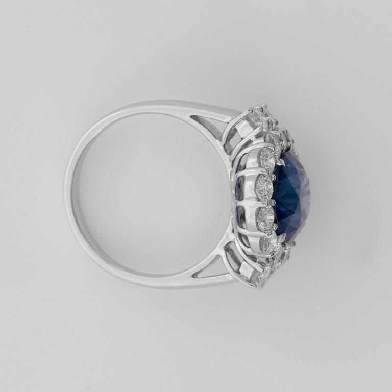 A 5.74 cts sapphire and diamond ring. Total carat weight 1.70 cts.