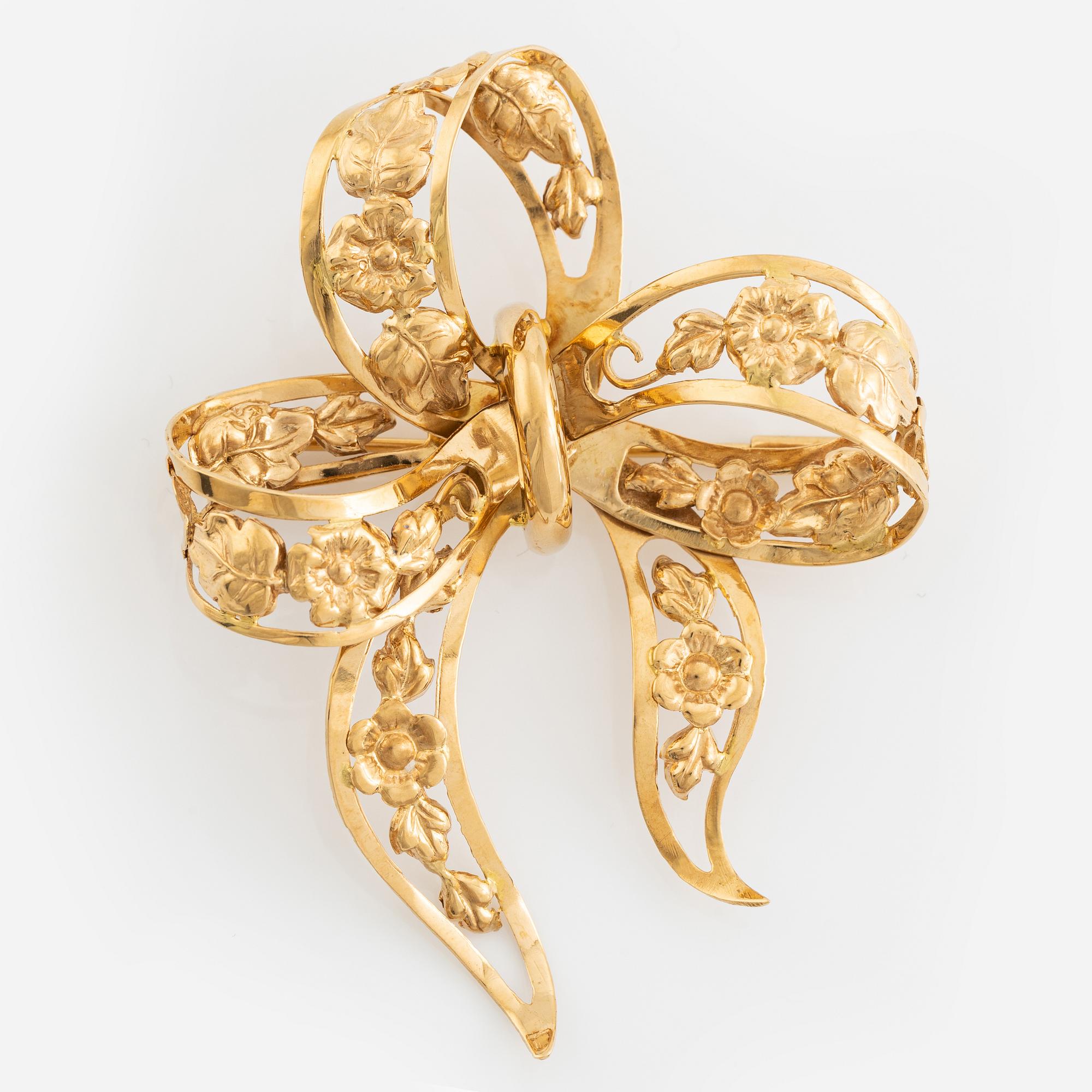 18K gold bow brooch.