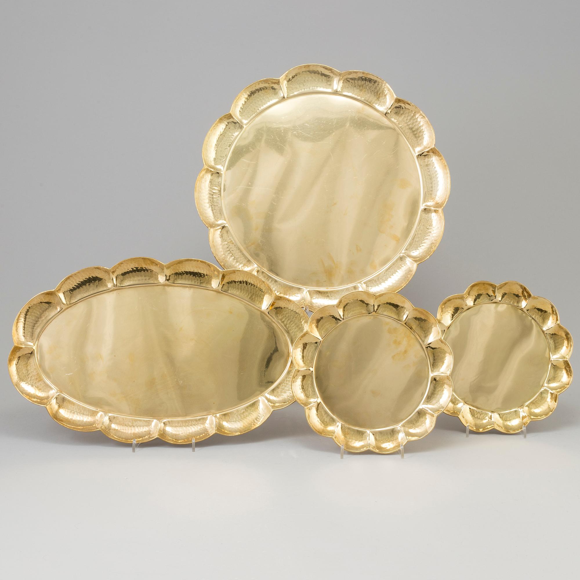 A set of four brass plates by Ture Henrikson, Arvika.