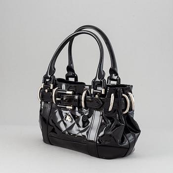 Burberry, a patent leather handbag.