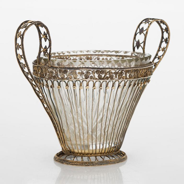 Gilded silver filigree bowl with a cut glass insert, late 19th century.