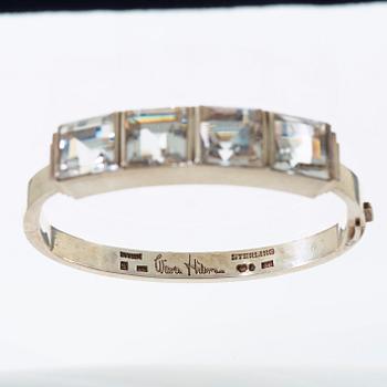 A Wiwen Nilsson sterling bangle with four facet cut rock crystals, Lund 1942.