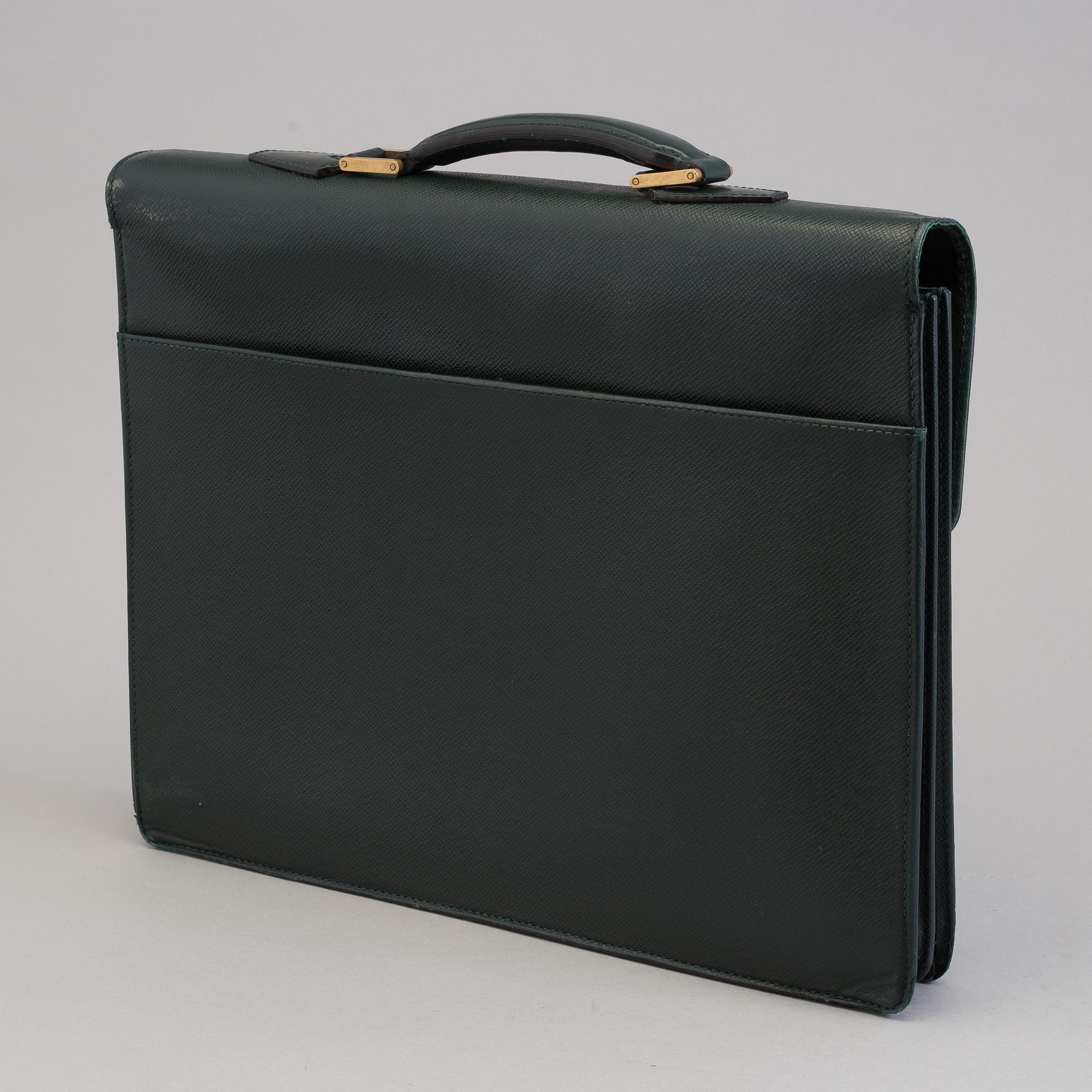 A Louis Vuitton green taiga Ambassador Briefcase.