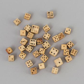 A COLLECTION OF 34 BONE MINIATURE DICE.