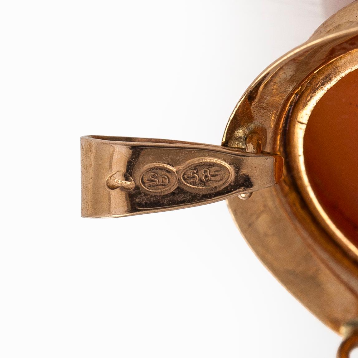 A 14K gold and shell cameo jewelry set, bracelet, pendant/brooch and ring.