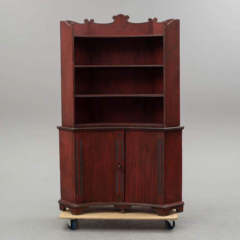 A 19th century corner cupboard.