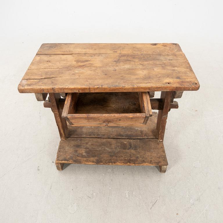 A wooden bench/sideboard from the first half of the 20th century.