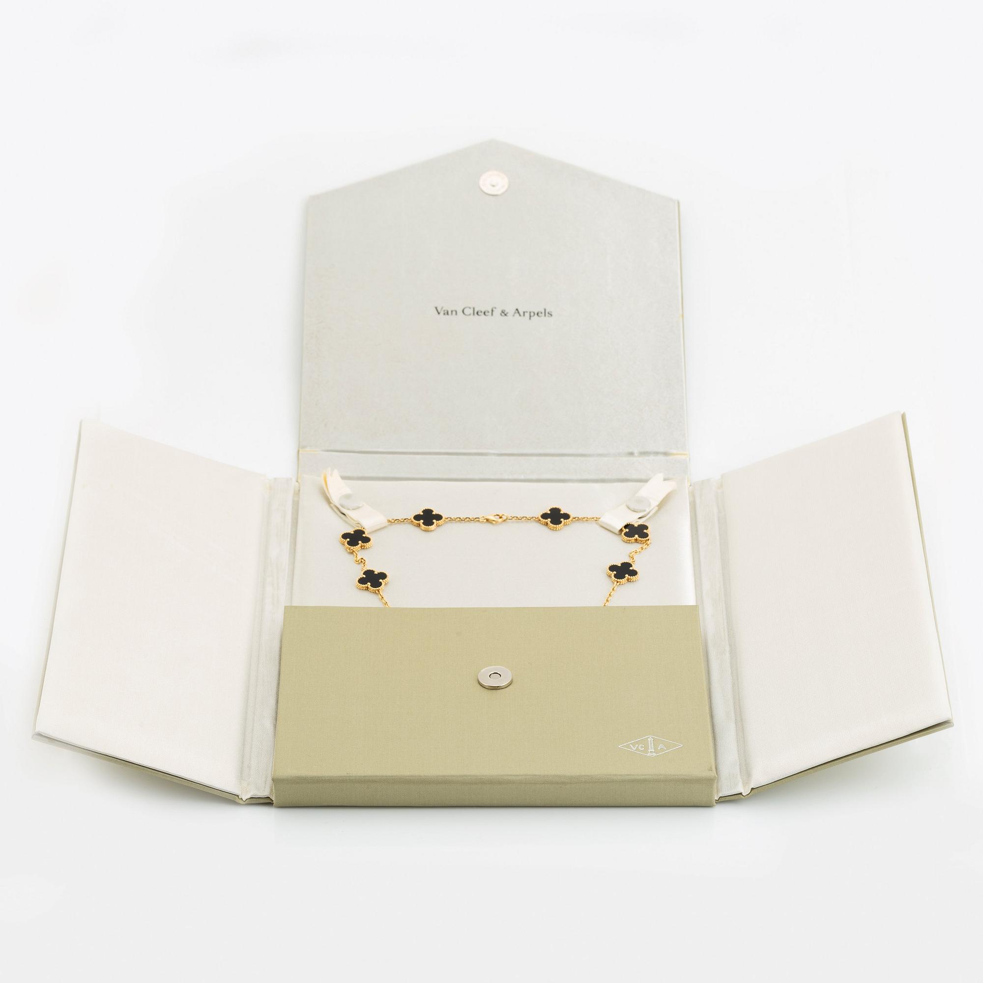A Van Cleef & Arpels "Alhambra" necklace in 18K gold and onyx.