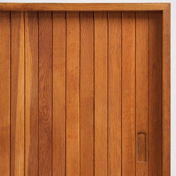 Jørgen Høj, an oak cabinet, Knud Willadsen Møbelsnedkeri, Lillerød, Denmark, 1950s.