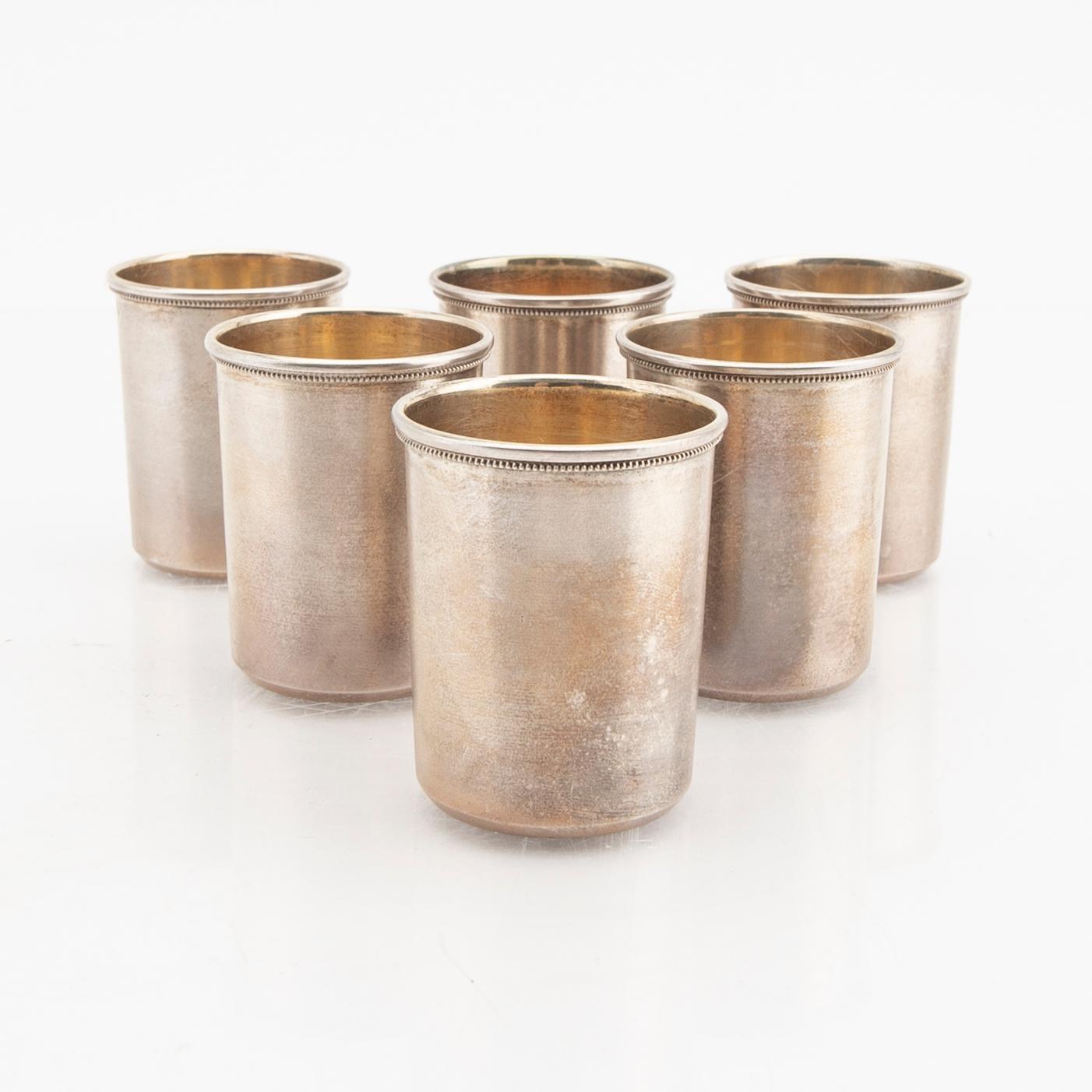 An eraly 20th century set of six silver cups mark of  Ivan Ekimovich Morozov St Petersburg weight 130 grams.