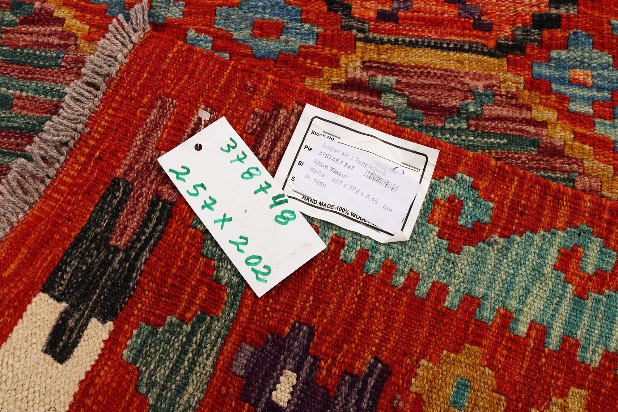 An Afghan kilim carpet, c. 257 x 202 cm.