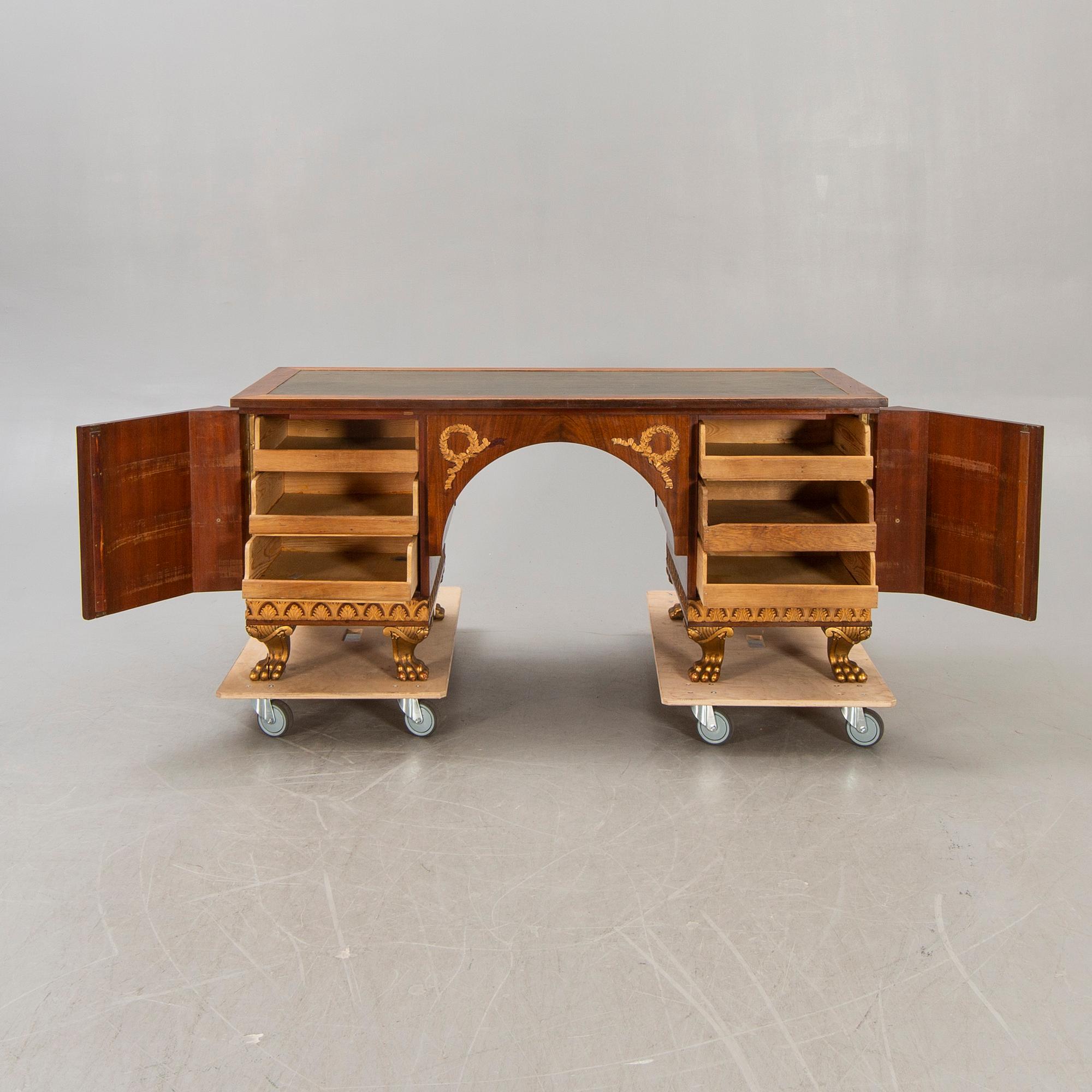 An Empire style mahogany desk 20th century.