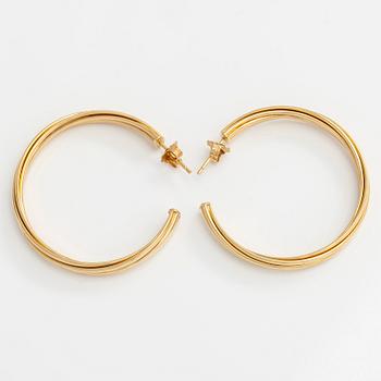 Tiffany & Co, Paloma Picasso, "Melody" hoop earrings in 18K gold.