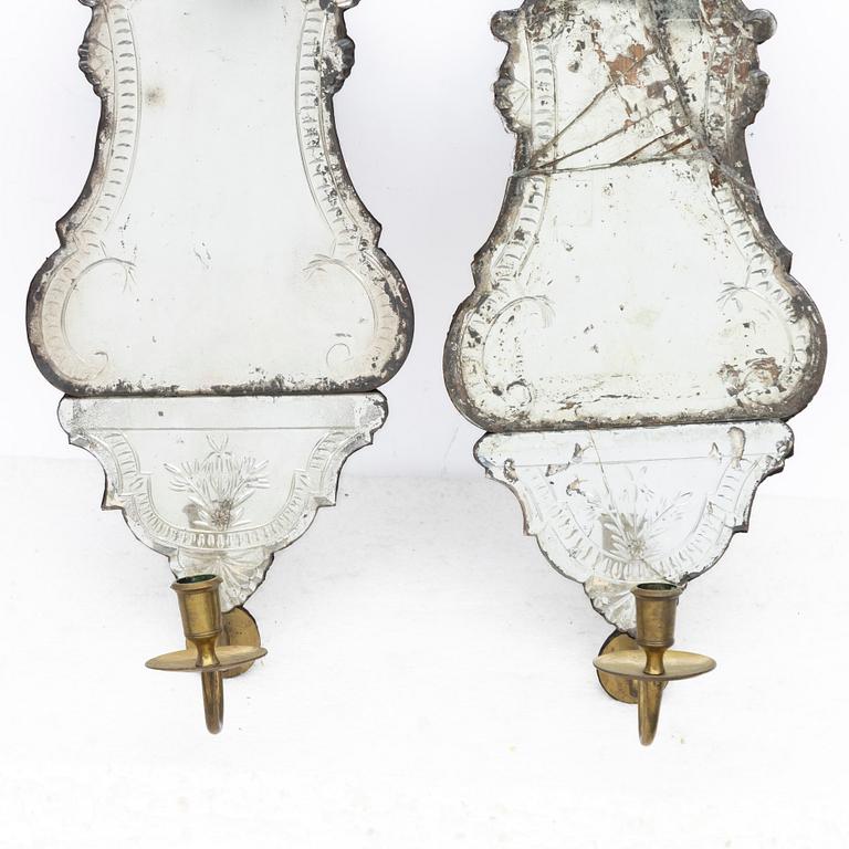A pair of Nort European late baroque one-light girandole mirrors, mid 18th century.