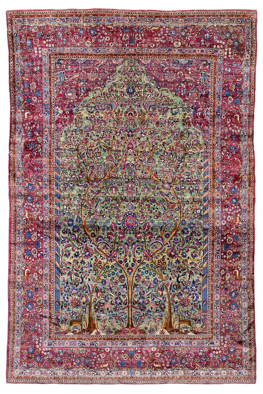 An antique silk Kashan carpet, central Persia, c. 319 x 206 cm.