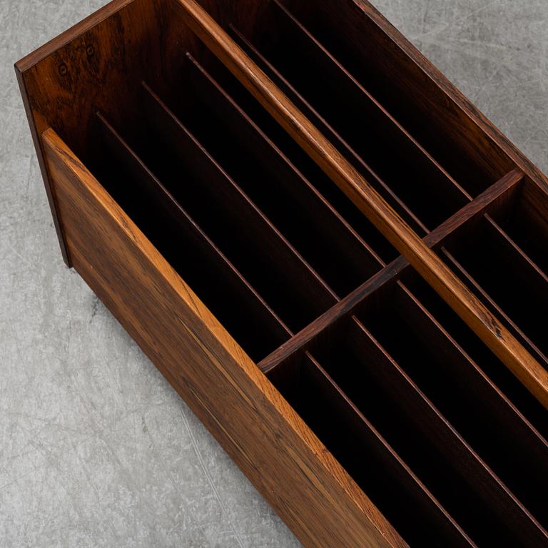ROLF HESLAND, a rosewood veneered newspaper/LP stand from Bruksbo, Norway.