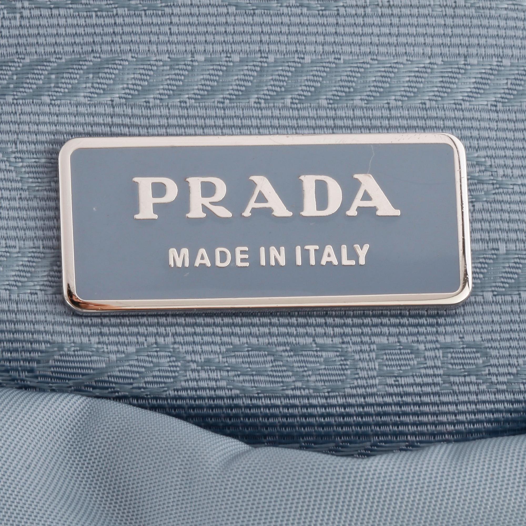 PRADA, a blue nylon crossbody bag.
