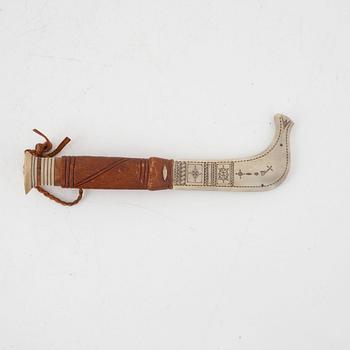 A reindeer horn knife, signed.