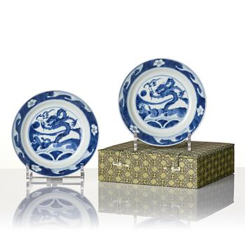 A pair of blue and white 'dragon and fish dishes', Qing dynasty, Kangxi (1662-1722).