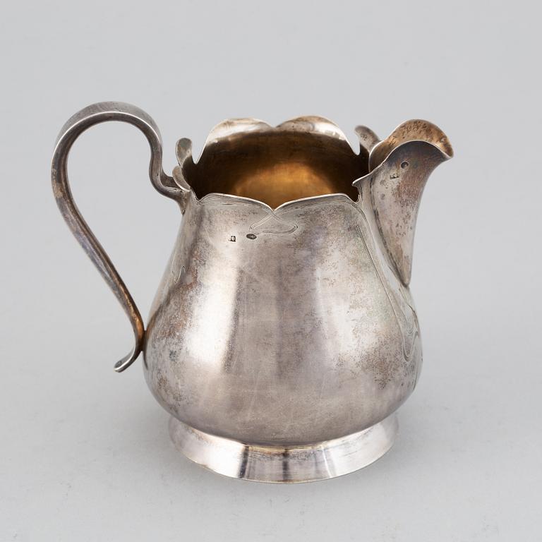 A Russian late 19th / early 20th century parcel-gilt silver cream-jug.