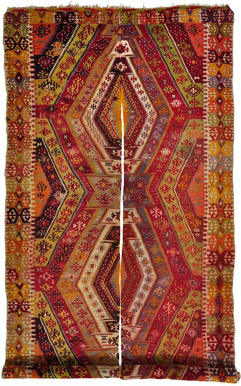 An Antique divided Anatolia kilim with similar patterns ca 433 x 185 cm.