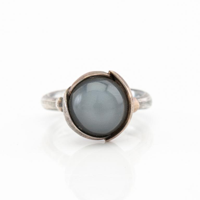 Ole Lynggaard, ring "Lotus" silver, white gold and cabochon-cut moonstone, design Charlotte Lynggaard.